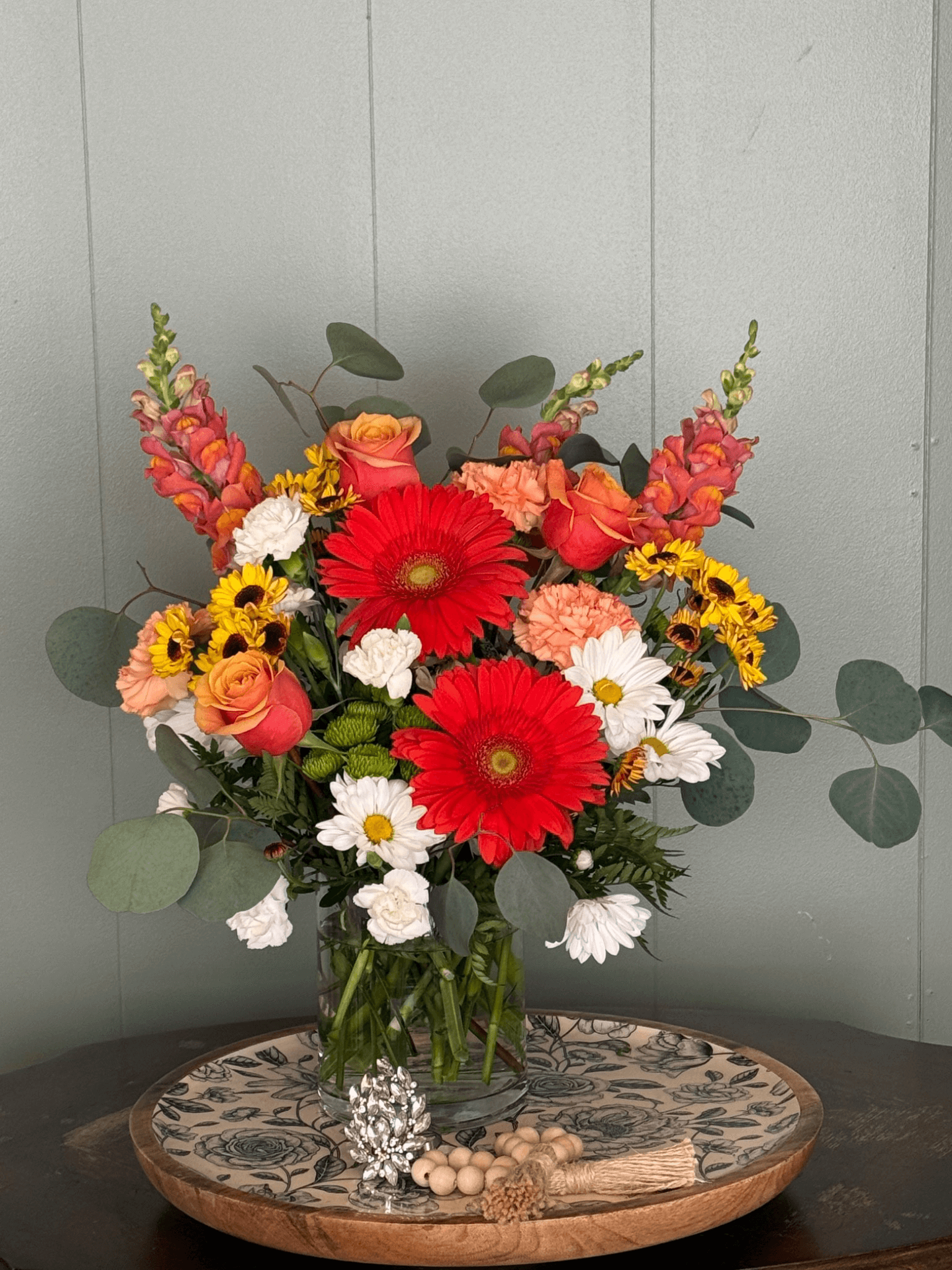 Sunburst-themed flower arrangement with bright yellow and orange blooms – Sunburst Garden